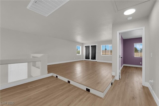 638 Ribbon Grass Ave, Las Vegas, NV 89183 - unfurnished room with light wood finished floors and healthy amount of natural light