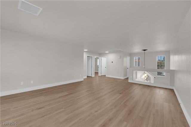 638 Ribbon Grass Ave, Las Vegas, NV 89183 - unfurnished living room featuring light wood-style floors and recessed lighting