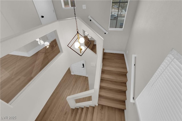 638 Ribbon Grass Ave, Las Vegas, NV 89183 - staircase with wood finished floors and a chandelier
