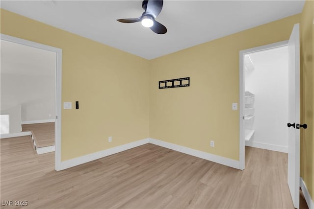 638 Ribbon Grass Ave, Las Vegas, NV 89183 - unfurnished room with light wood-style floors and a ceiling fan