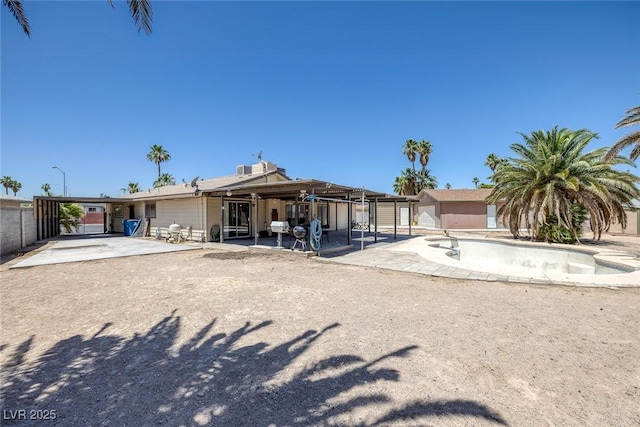 4458 El Quinta Ct, Las Vegas, NV 89121 - back of property featuring a patio area and an outdoor structure
