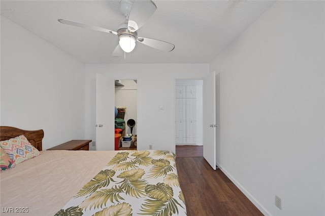 4458 El Quinta Ct, Las Vegas, NV 89121 - bedroom featuring wood finished floors, a walk in closet, ceiling fan, and a closet