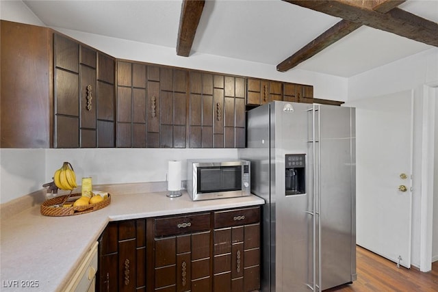 4458 El Quinta Ct, Las Vegas, NV 89121 - kitchen with appliances with stainless steel finishes, beam ceiling, light countertops, dark wood-type flooring, and dark brown cabinets