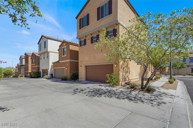 8949 Merry Mullion Ct, Las Vegas, NV 89149 - view of building exterior featuring a residential view and a garage