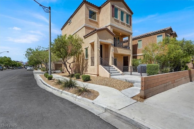 8949 Merry Mullion Ct, Las Vegas, NV 89149 - townhome / multi-family property with stucco siding and a tiled roof
