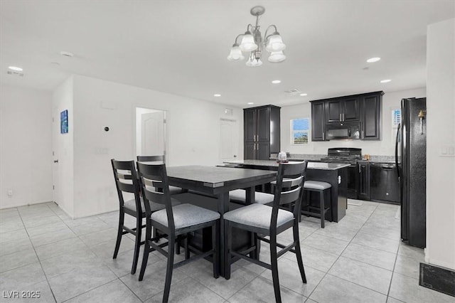 8949 Merry Mullion Ct, Las Vegas, NV 89149 - dining space featuring a chandelier, light tile patterned floors, and recessed lighting