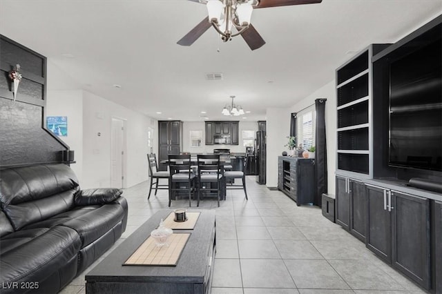 8949 Merry Mullion Ct, Las Vegas, NV 89149 - living area with a ceiling fan, light tile patterned floors, a chandelier, and recessed lighting