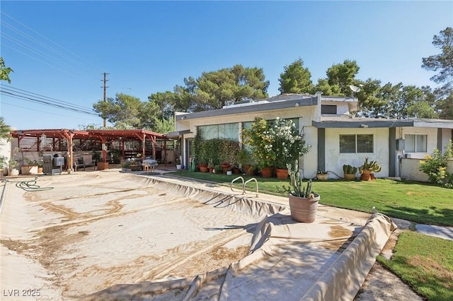 55 Siddall Ave, Las Vegas, NV 89183 - rear view of house featuring a pergola, a yard, stucco siding, and a patio area