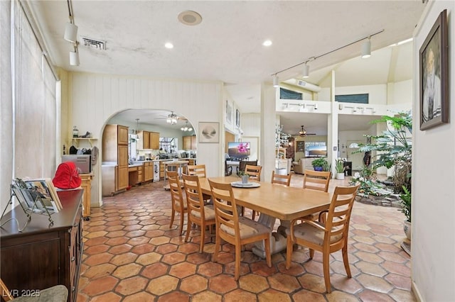 55 Siddall Ave, Las Vegas, NV 89183 - dining space with rail lighting, ceiling fan, arched walkways, and recessed lighting