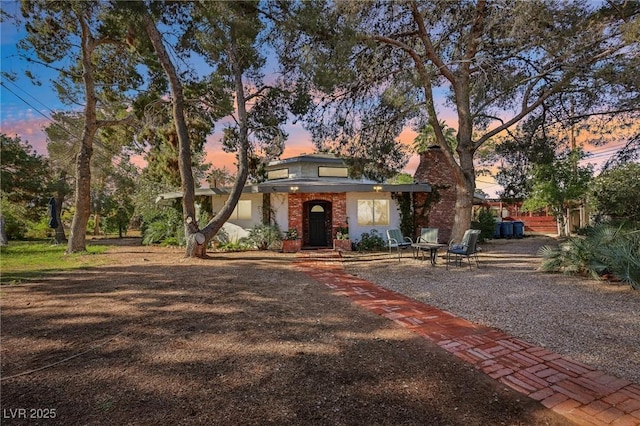 55 Siddall Ave, Las Vegas, NV 89183 - view of front of home with brick siding and a chimney
