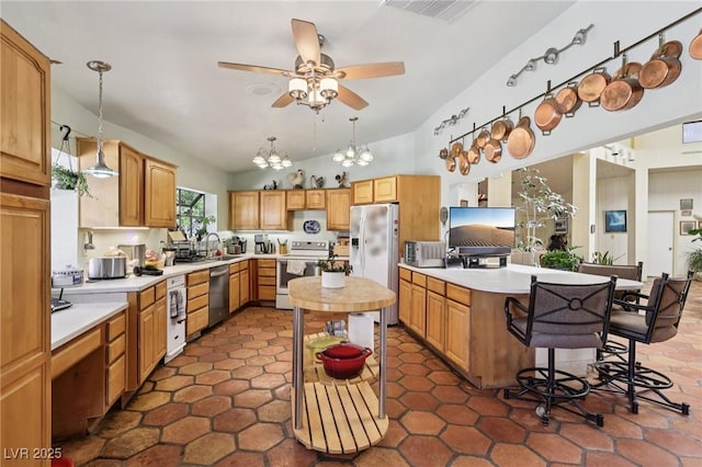 55 Siddall Ave, Las Vegas, NV 89183 - kitchen with white appliances, light countertops, a kitchen island, a ceiling fan, and pendant lighting