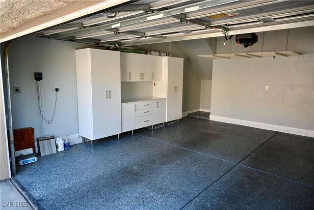 248 Crystal Rose Ct, Las Vegas, NV 89106 - garage featuring a garage door opener and baseboards