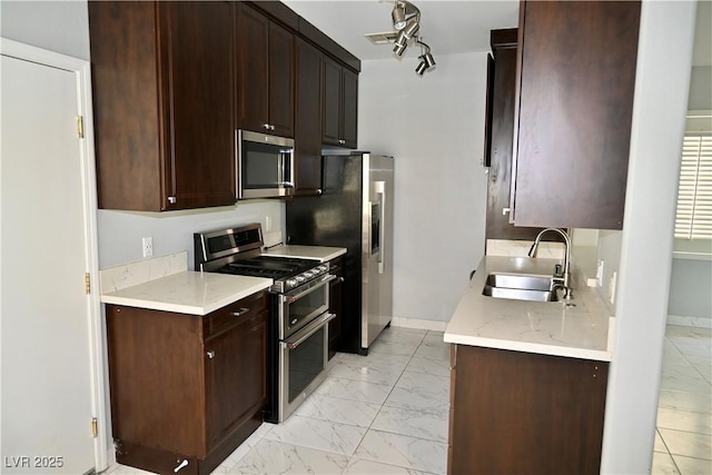 248 Crystal Rose Ct, Las Vegas, NV 89106 - kitchen featuring appliances with stainless steel finishes, light marble finish flooring, and dark brown cabinets