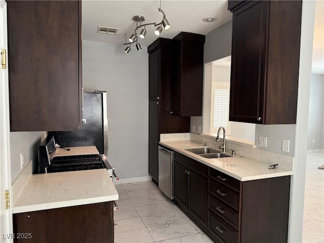 248 Crystal Rose Ct, Las Vegas, NV 89106 - kitchen with appliances with stainless steel finishes, light marble finish floors, dark brown cabinetry, and light stone countertops