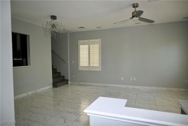 248 Crystal Rose Ct, Las Vegas, NV 89106 - empty room featuring marble finish floors, stairway, and a ceiling fan