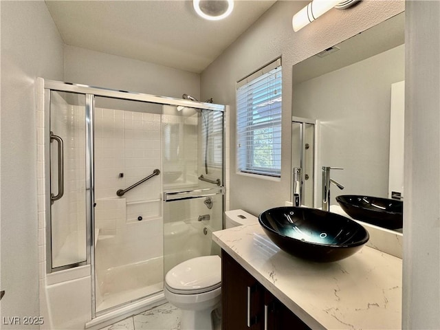 248 Crystal Rose Ct, Las Vegas, NV 89106 - bathroom featuring marble look tiles, vanity, and an enclosed shower