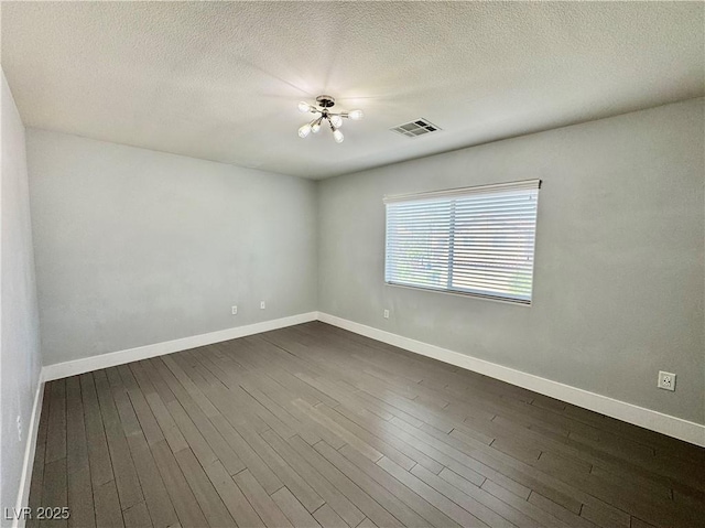 248 Crystal Rose Ct, Las Vegas, NV 89106 - empty room with dark wood finished floors and a textured ceiling