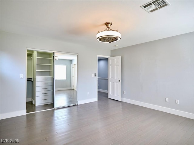 248 Crystal Rose Ct, Las Vegas, NV 89106 - unfurnished bedroom with dark wood finished floors and a closet