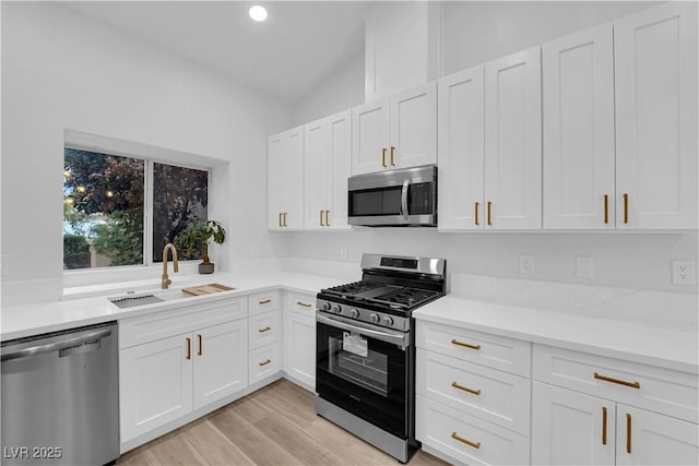 9412 Mount Cherie Ave Unit 102, Las Vegas, NV 89129 - kitchen with stainless steel appliances, light countertops, white cabinets, and recessed lighting