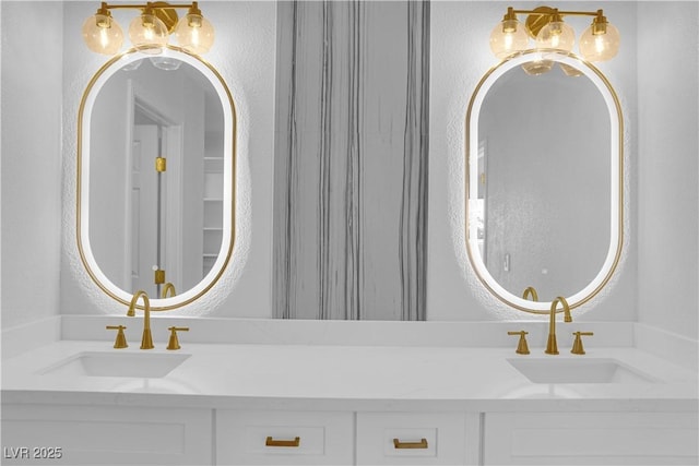 9412 Mount Cherie Ave Unit 102, Las Vegas, NV 89129 - bathroom featuring double vanity and a textured wall
