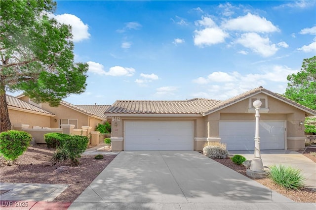 9412 Mount Cherie Ave Unit 102, Las Vegas, NV 89129 - view of front of home featuring stucco siding, driveway, a garage, and a tiled roof