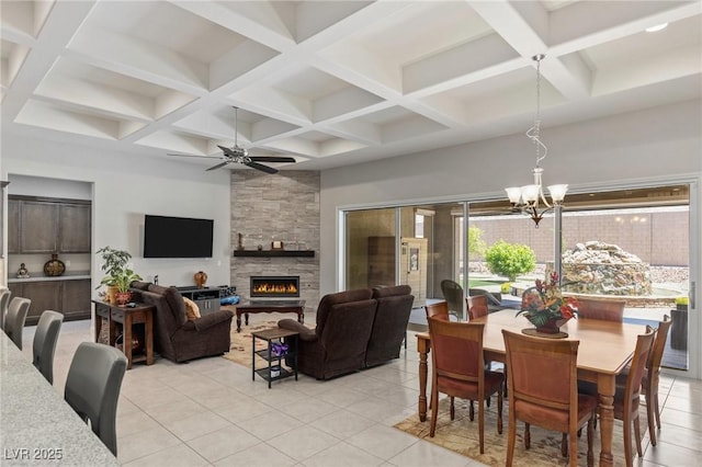 6315 Carol Butte Ct, Las Vegas, NV 89141 - dining area with a chandelier, coffered ceiling, light tile patterned floors, a ceiling fan, and a fireplace