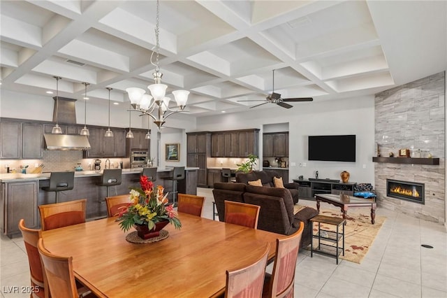 6315 Carol Butte Ct, Las Vegas, NV 89141 - dining room with light tile patterned flooring, coffered ceiling, a ceiling fan, a towering ceiling, and a fireplace
