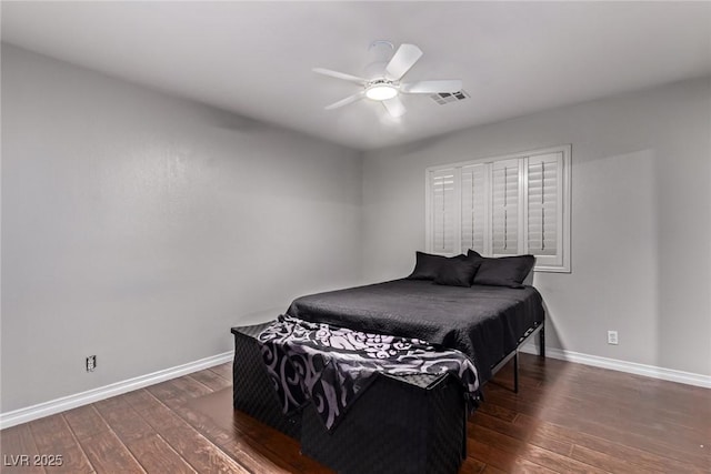 6307 Dusty Mile Ct, North Las Vegas, NV 89031 - bedroom featuring dark wood-type flooring and a ceiling fan