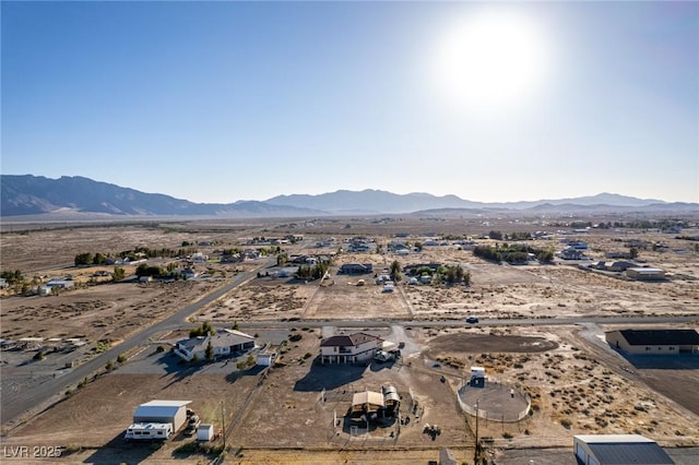 3821 Tumbleweed Ave, Pahrump, NV 89048 - aerial view of sparsely populated area featuring a mountain backdrop and a desert landscape