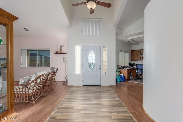 3821 Tumbleweed Ave, Pahrump, NV 89048 - foyer entrance featuring a ceiling fan, wood finished floors, and a high ceiling