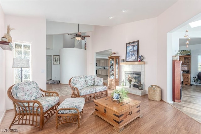 3821 Tumbleweed Ave, Pahrump, NV 89048 - living area featuring wood finished floors, ceiling fan, and a tile fireplace