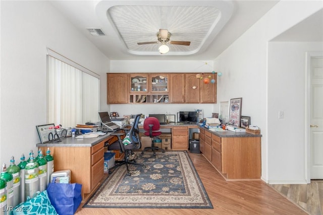 3821 Tumbleweed Ave, Pahrump, NV 89048 - office space with built in desk, light wood-style flooring, and ceiling fan