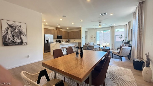 739 Wild Highlands Ln, Henderson, NV 89015 - dining area with light wood-style flooring, a ceiling fan, and recessed lighting
