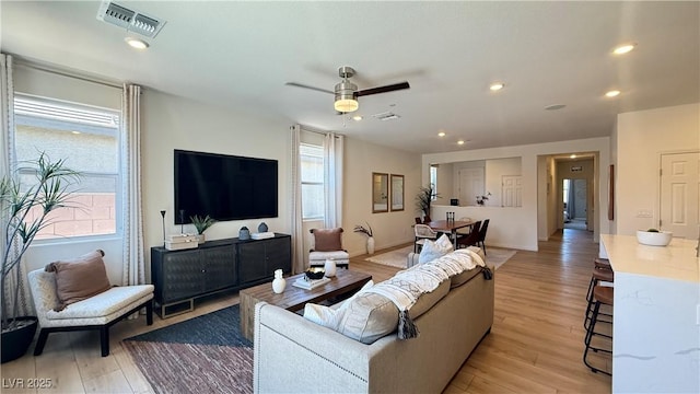 739 Wild Highlands Ln, Henderson, NV 89015 - living room with light wood-style flooring, a ceiling fan, and recessed lighting