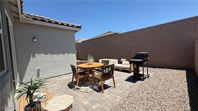 739 Wild Highlands Ln, Henderson, NV 89015 - fenced backyard featuring grilling area, a patio area, and outdoor dining space