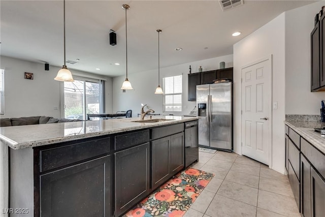 889 Harbor Ave, Henderson, NV 89002 - kitchen featuring stainless steel fridge with ice dispenser, dishwashing machine, open floor plan, a kitchen island with sink, and light tile patterned flooring