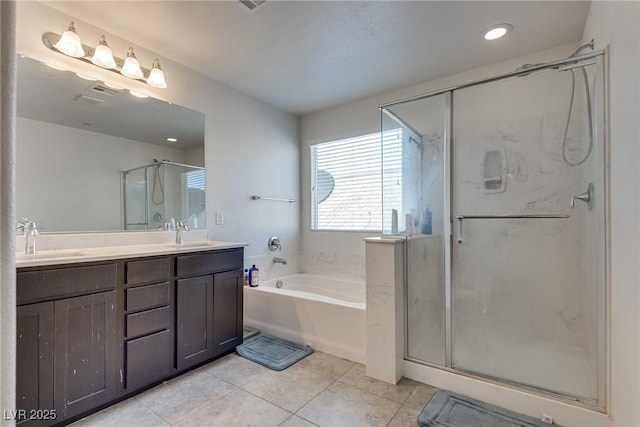 889 Harbor Ave, Henderson, NV 89002 - bathroom with a bath, double vanity, a shower stall, tile patterned flooring, and recessed lighting