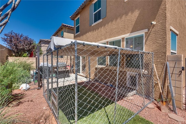 889 Harbor Ave, Henderson, NV 89002 - view of property exterior with stucco siding, a fenced backyard, a tile roof, and a patio