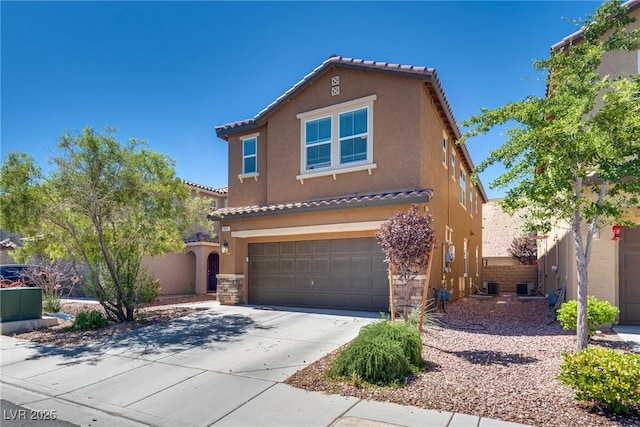 889 Harbor Ave, Henderson, NV 89002 - mediterranean / spanish house with stucco siding, an attached garage, driveway, and a tiled roof