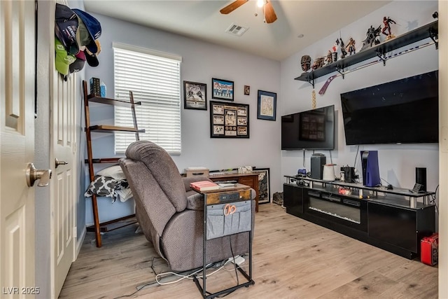 889 Harbor Ave, Henderson, NV 89002 - living room featuring light wood-style floors, ceiling fan, and a desk