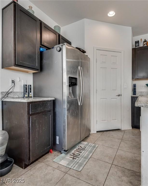 889 Harbor Ave, Henderson, NV 89002 - kitchen featuring dark brown cabinets, light tile patterned flooring, recessed lighting, and stainless steel fridge with ice dispenser