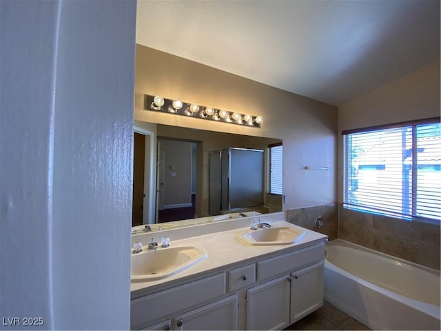 7604 Cruz Bay Ct, Las Vegas, NV 89128 - full bath with a garden tub, double vanity, a shower stall, and tile patterned floors
