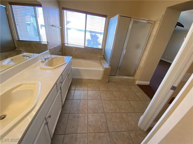 7604 Cruz Bay Ct, Las Vegas, NV 89128 - bathroom with tile patterned floors, a garden tub, a stall shower, and double vanity