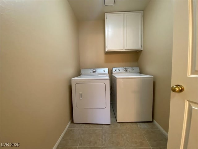 7604 Cruz Bay Ct, Las Vegas, NV 89128 - washroom with cabinet space, washing machine and clothes dryer, and light tile patterned flooring