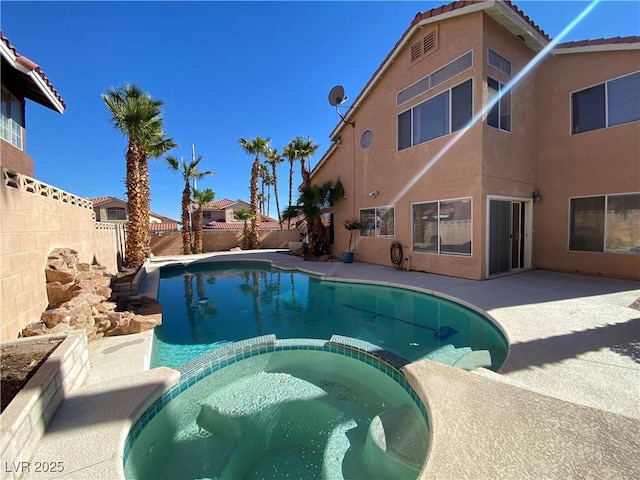 7604 Cruz Bay Ct, Las Vegas, NV 89128 - view of swimming pool with a pool with connected hot tub, a fenced backyard, and a patio area