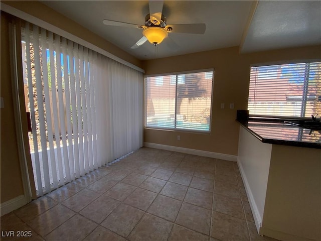 7604 Cruz Bay Ct, Las Vegas, NV 89128 - tiled empty room with baseboards and ceiling fan