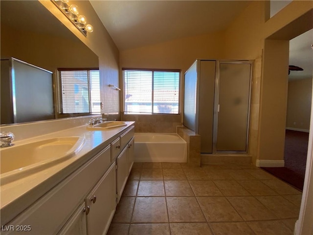 7604 Cruz Bay Ct, Las Vegas, NV 89128 - bathroom featuring vaulted ceiling, a garden tub, a stall shower, double vanity, and tile patterned flooring