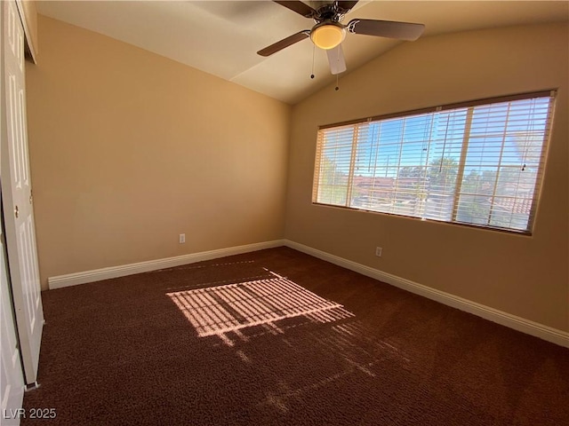 7604 Cruz Bay Ct, Las Vegas, NV 89128 - spare room featuring dark colored carpet, lofted ceiling, and a ceiling fan