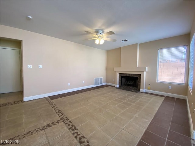7604 Cruz Bay Ct, Las Vegas, NV 89128 - unfurnished living room with tile patterned flooring, a ceiling fan, and a premium fireplace