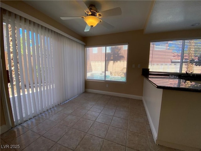 7604 Cruz Bay Ct, Las Vegas, NV 89128 - tiled spare room featuring baseboards and ceiling fan
